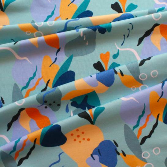 Tela de lycra de baño estampado abstracto azul para coser bañadores o bikinis