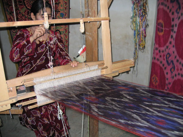 "Weaving Silk Ikat textile" by CarpetView is licensed under CC BY-NC-SA 2.0